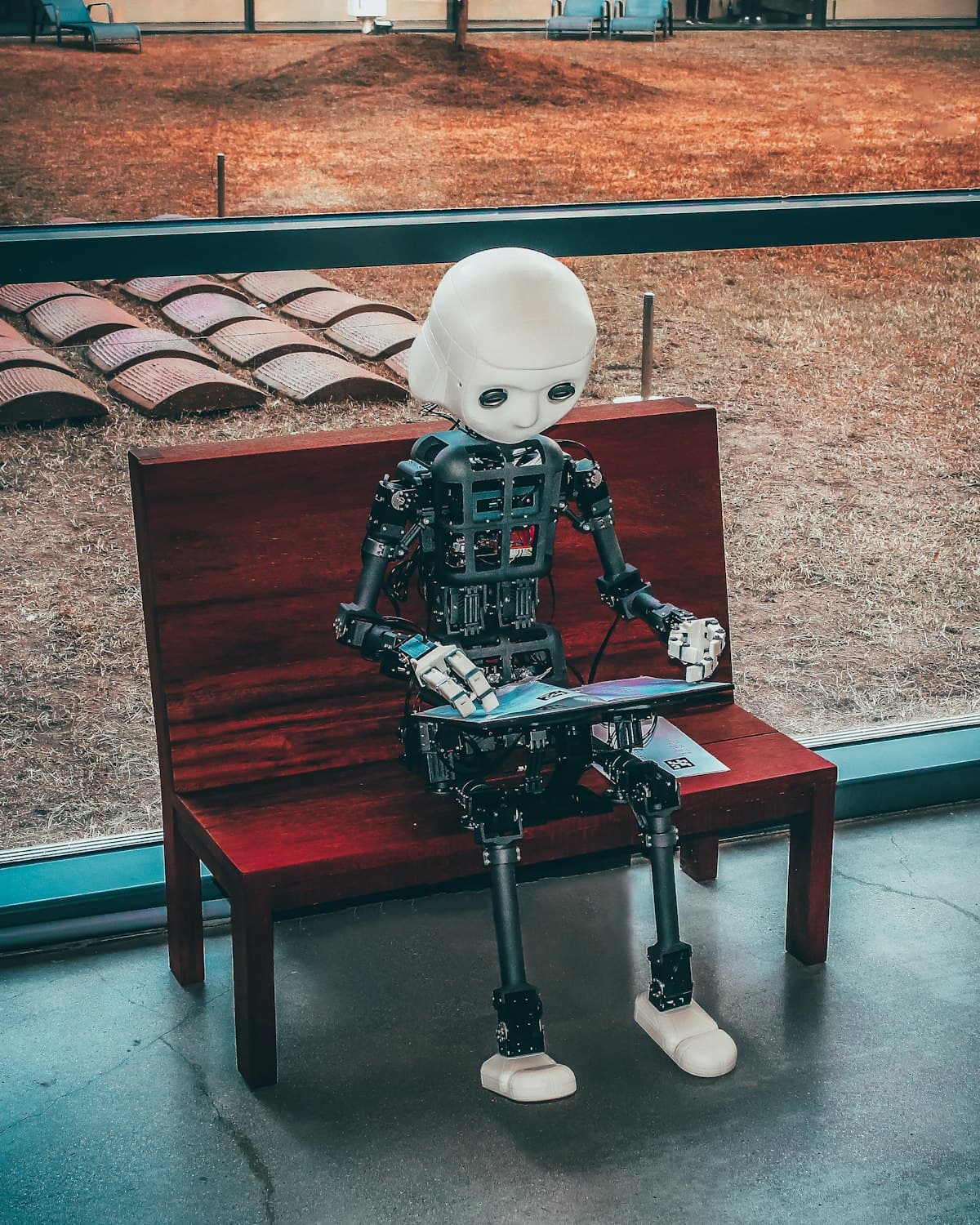 A humanoid robot reading — artificial intelligence at work